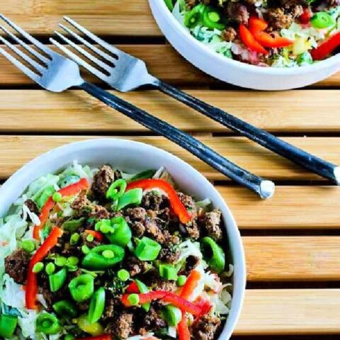 Sriracha Beef Cabbage Bowl shown in two bowls with forks.
